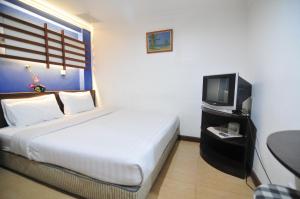 Ein Bett oder Betten in einem Zimmer der Unterkunft Hotel China Town 2