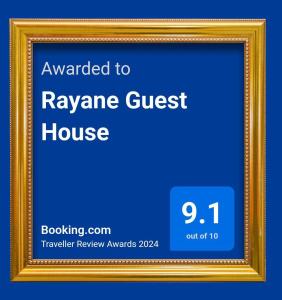 un panneau encadré pour la maison d'hôtes aryan dans un cadre en or dans l'établissement Rayane Guest House, à Taghazout