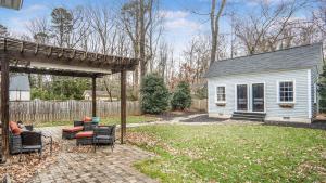a backyard with a gazebo and a house at 4-bedroom Bliss With Downtown Proximity in Greensboro