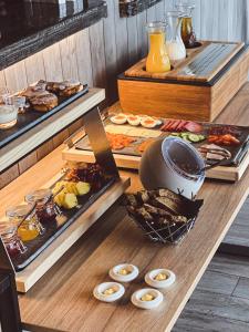 a table with a bunch of different types of food at Lyngen North in Rotsund
