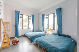 Postel nebo postele na pokoji v ubytování Kim Little Hotel Dalat