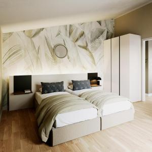 ein Schlafzimmer mit einem großen Bett und einem Gemälde an der Wand in der Unterkunft Residence San Michele in Costermano sul Garda