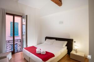 Posteľ alebo postele v izbe v ubytovaní Urbanicooh Garisenda - Piazza Maggiore View