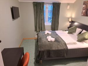 Letto o letti in una camera di Tune Hotell Sarpsborg