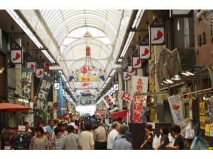a crowd of people walking through a shopping mall at Akashi Castle Hotel - Vacation STAY 83573 in Akashi