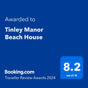 Ett certifikat, pris eller annat dokument som visas upp på Tinley Manor Beach House