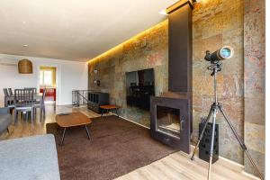 a living room with a brick wall with a fireplace at Amazing Sea Views Santa Pola AC in Santa Pola