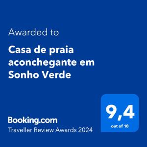 Ett certifikat, pris eller annat dokument som visas upp på Casa de praia aconchegante em Sonho Verde