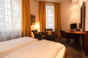 TV a/nebo společenská místnost v ubytování Hotel Carlton Munich