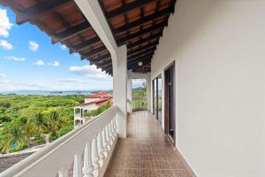 a balcony of a house with a view at Outstanding & Huge 600m Private Villa - Pool - BBQ in Coco