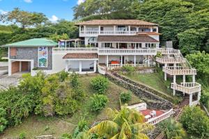 an aerial view of a house on a hill at Outstanding & Huge 600m Private Villa - Pool - BBQ in Coco