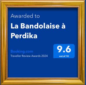 a picture of a sign in a gold frame at La Bandolaise à Perdika in Perdika