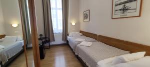 Posteľ alebo postele v izbe v ubytovaní Budapest Csaszar Hotel