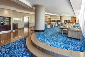 a hotel lobby with a blue and white carpet at Garden Court Kings Beach in Port Elizabeth