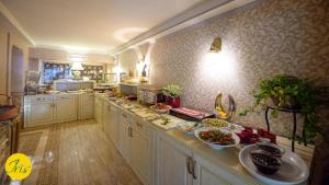 Kuchyň nebo kuchyňský kout v ubytování Hotel Iris-Mimoza