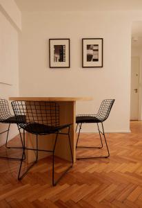 a table and two chairs in a room at Hestia At Patio Bullrich 1bdr Apartment in Buenos Aires