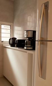 a kitchen with a refrigerator and a microwave at Hestia At Patio Bullrich 1bdr Apartment in Buenos Aires