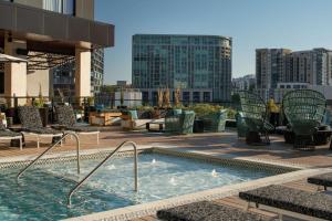 a swimming pool on top of a building at Hotel Fraye Nashville, Curio Collection By Hilton in Nashville