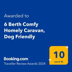 a yellow sign that reads awarded to belt county honey caravan dog friendly at 6 Berth Comfy Homely Caravan, Dog Friendly in Belton