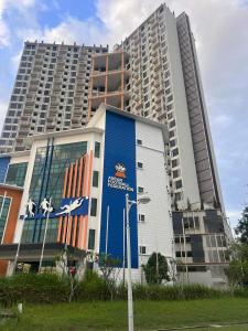 a large tall building with a large building at Putrajaya AQ Homestay (Near PICC) in Putrajaya