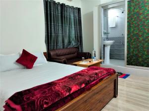 Postel nebo postele na pokoji v ubytování Hotel Shopno Nibash