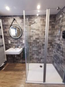 a bathroom with a shower and a sink at Ferienwohnung Seeloft in Emden