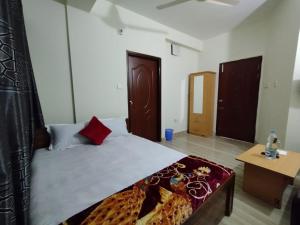Postel nebo postele na pokoji v ubytování Hotel Shopno Nibash