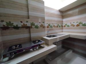 Kuchyň nebo kuchyňský kout v ubytování Hotel Shopno Nibash