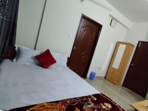 Postel nebo postele na pokoji v ubytování Hotel Shopno Nibash