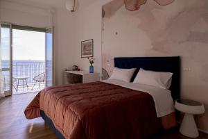 Posteľ alebo postele v izbe v ubytovaní Cas’ A Mare - Beachfront Luxury Suites
