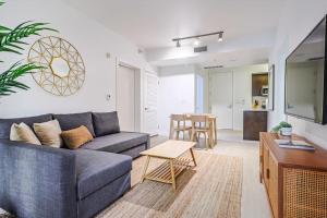 a living room with a couch and a table at Stylish & Cozy 2BDR & 2BTH in SM with Balcony for 6 pax in Los Angeles