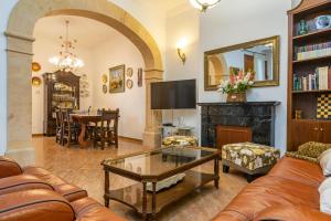 a living room with a couch and a table at Can Serra 4 -Santa Margalida- in Santa Margalida