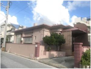 a house on the side of a street at Purple House in Chatan