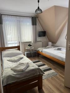 Posteľ alebo postele v izbe v ubytovaní Willa Mery