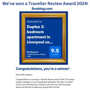a flyer for a travel review award with a gold frame at Duplex 2-bedroom apartment in Liverpool centre in Liverpool