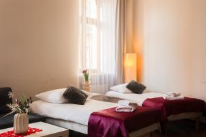 Postel nebo postele na pokoji v ubytování Apartamenty Przemyśl