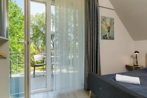 En eller flere senge i et værelse på Villa 21 Boutique Rooms