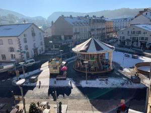 a gazebo with a tent in a city at Duplex de 40 m2 en hyper centre in Gérardmer