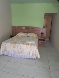 Een bed of bedden in een kamer bij Pousada Umari