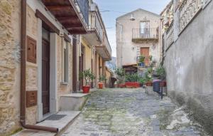 an alley in an old town with buildings at 1 Bedroom Lovely Apartment In San Piero Patti in San Piero Patti