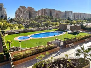 Bazén v ubytování ACV - Torremar-2ª línea planta 1 norte nebo v jeho okolí