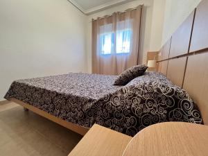 Postel nebo postele na pokoji v ubytování ACV - Torremar-2ª línea planta 1 norte