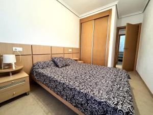 Postel nebo postele na pokoji v ubytování ACV - Torremar-2ª línea planta 1 norte