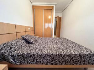 Postel nebo postele na pokoji v ubytování ACV - Torremar-2ª línea planta 1 norte