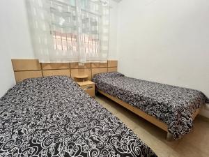Postel nebo postele na pokoji v ubytování ACV - Torremar-2ª línea planta 1 norte