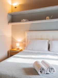 Ένα ή περισσότερα κρεβάτια σε δωμάτιο στο Casa Giulia - Appartamento a San Gimignano