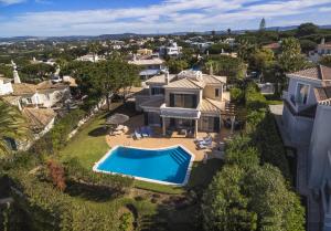 an aerial view of a house with a swimming pool at Vale De Lobo Villa With Pool by Homing in Vale do Lobo