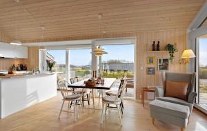 a kitchen and dining room with a table and chairs at Stunning Home In Haarby With Kitchen in Hårby