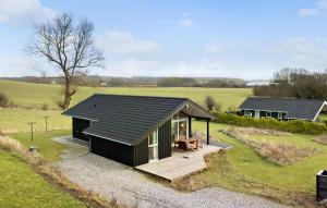 an overhead view of a small house in a field at Stunning Home In Haarby With Kitchen in Hårby