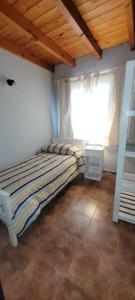 Ένα ή περισσότερα κρεβάτια σε δωμάτιο στο Blue House 3 Villa La Angostura